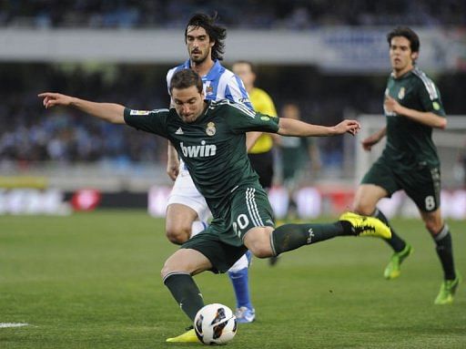 Real Madrid's Gonzalo Higuain kicks the ball at Anoeta stadium in San Sebastian on May 26, 2013